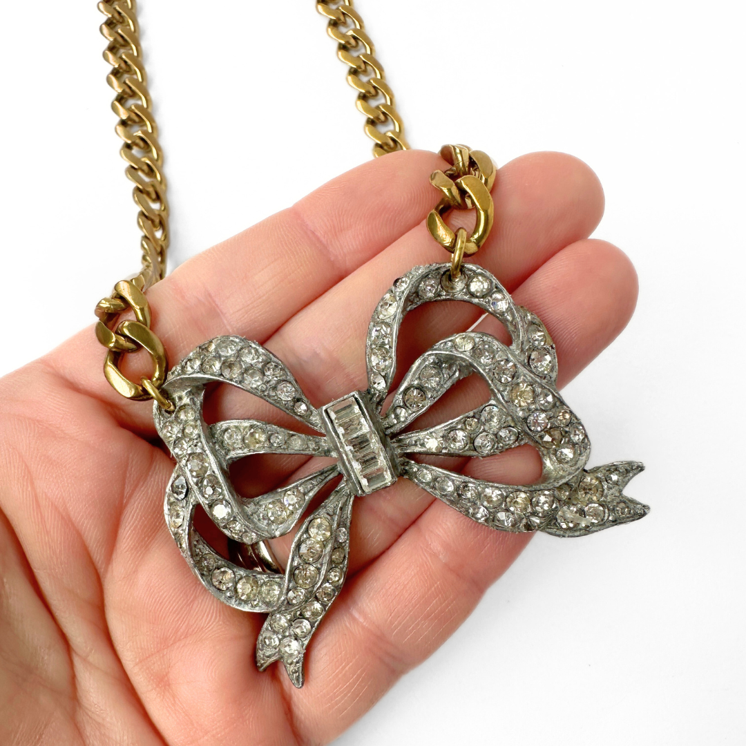 Refashioned vintage large rhinestone bow necklace with brass curb chain
