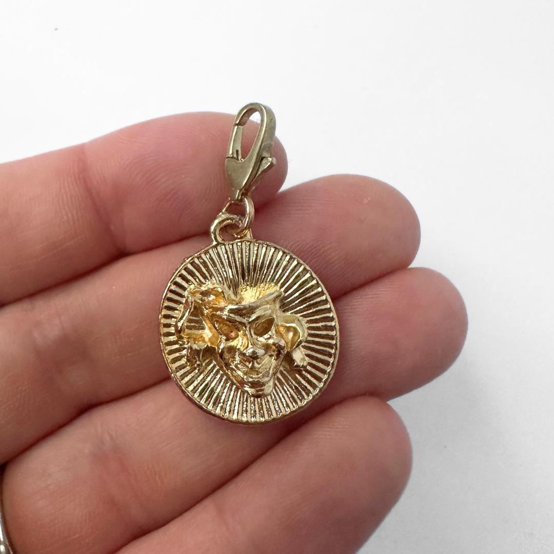 Vintage gold circular comedy and tragedy mask charm pendant
