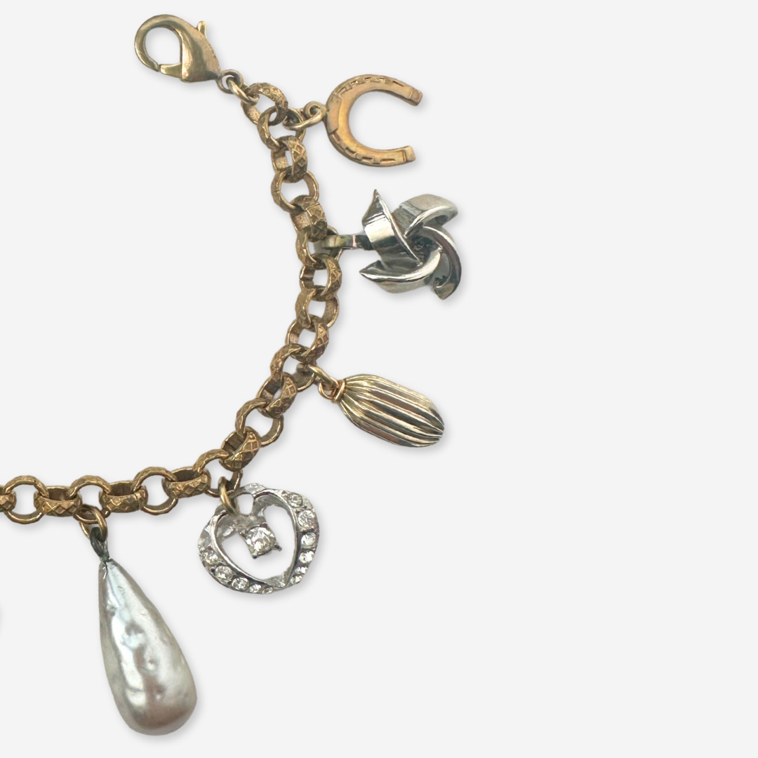Repurposed vintage neutral mixed charm bracelet