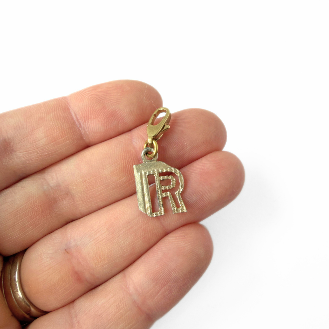Small vintage gold tone cutout "R" monogram charm