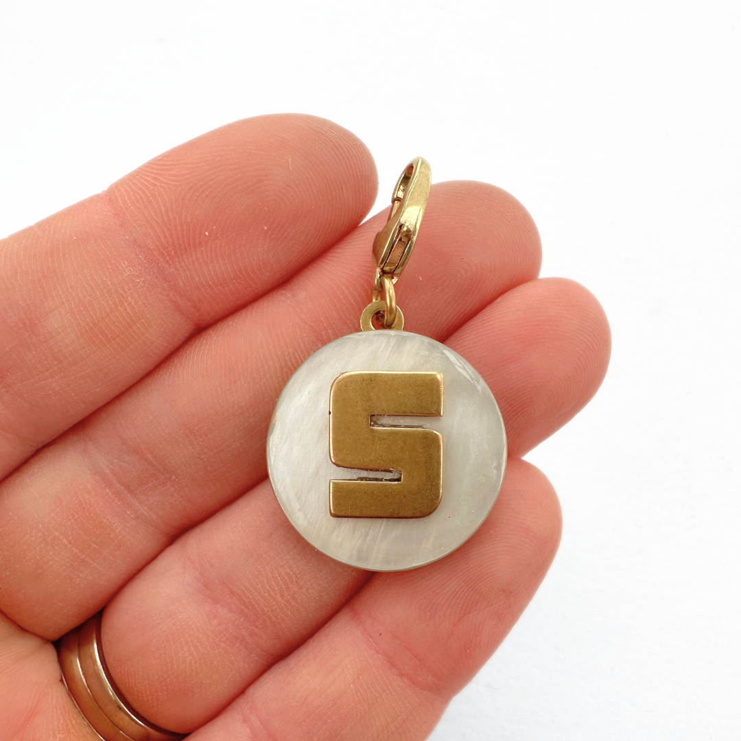 Vintage mother of pearl and brass "S" monogram circular charm