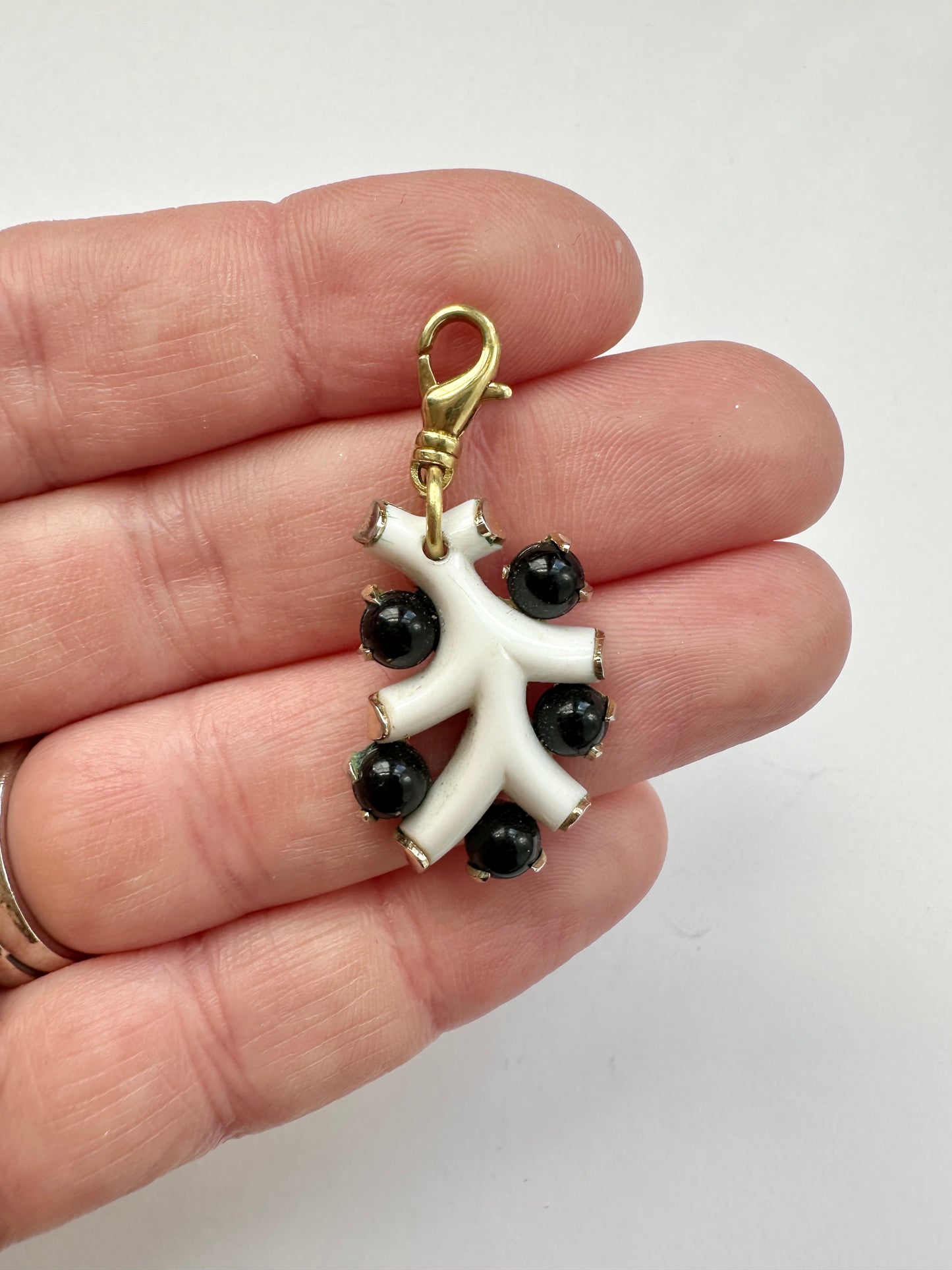 Vintage black and white celluloid charm with brass swivel clasp