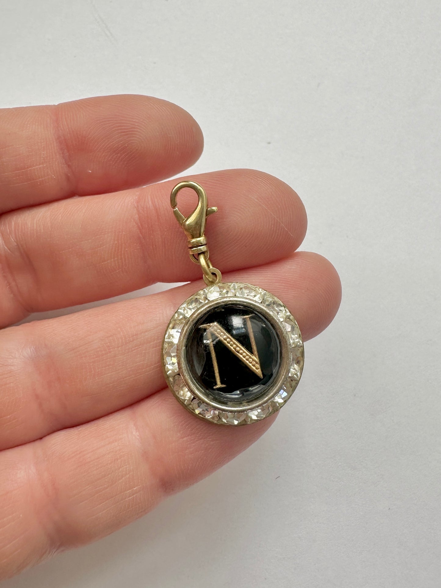 Vintage black letter "N" charm in clear rhinestone round setting