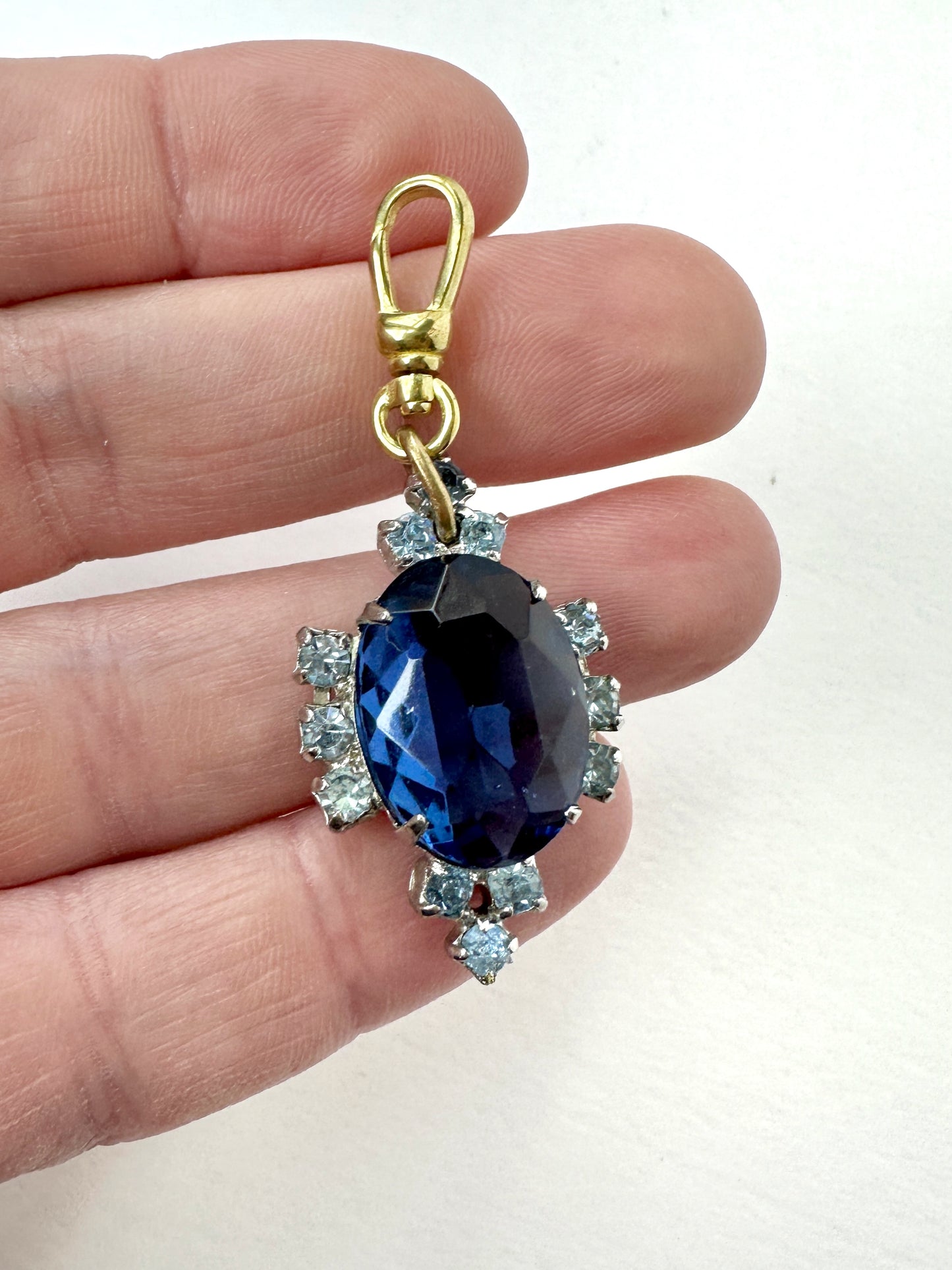 Vintage sapphire blue oval rhinestone charm with raw brass swivel clasp