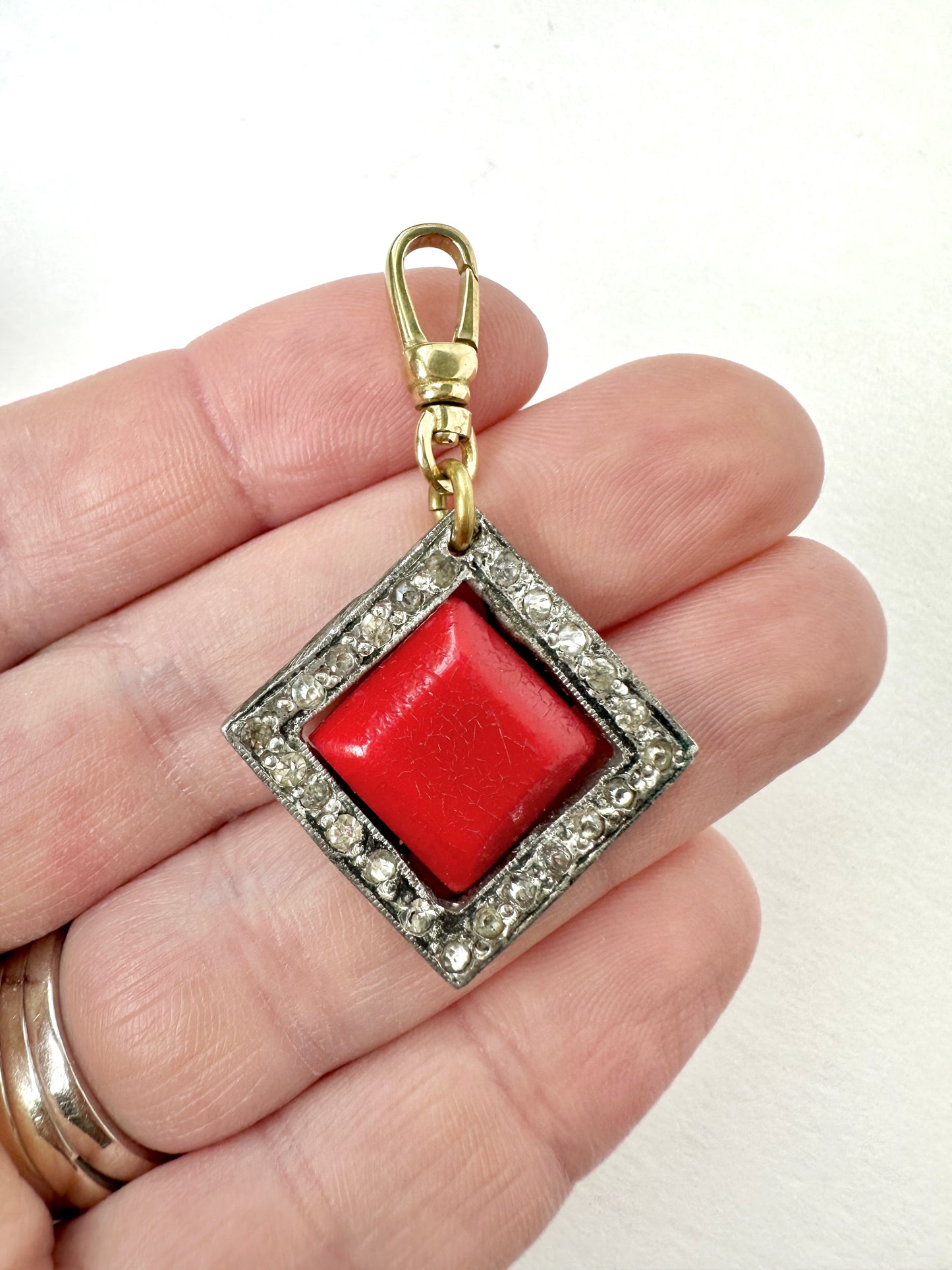 Vintage red celluloid and clear rhinestone square charm with swivel clasp