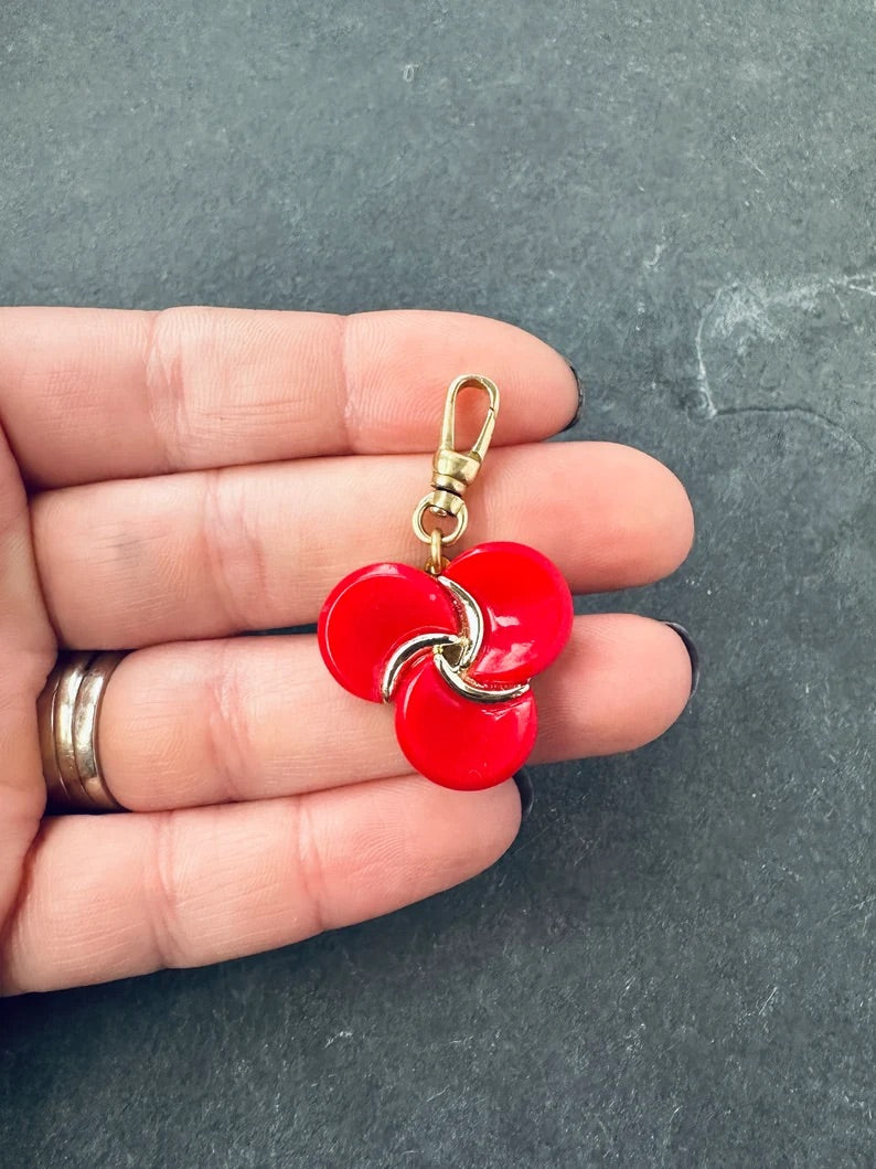 Vintage red thermoset pinwheel charm