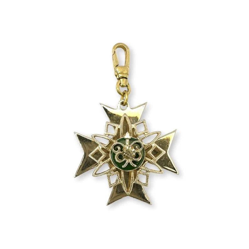 Vintage gold plated large crest with green enamel and rhinestone center