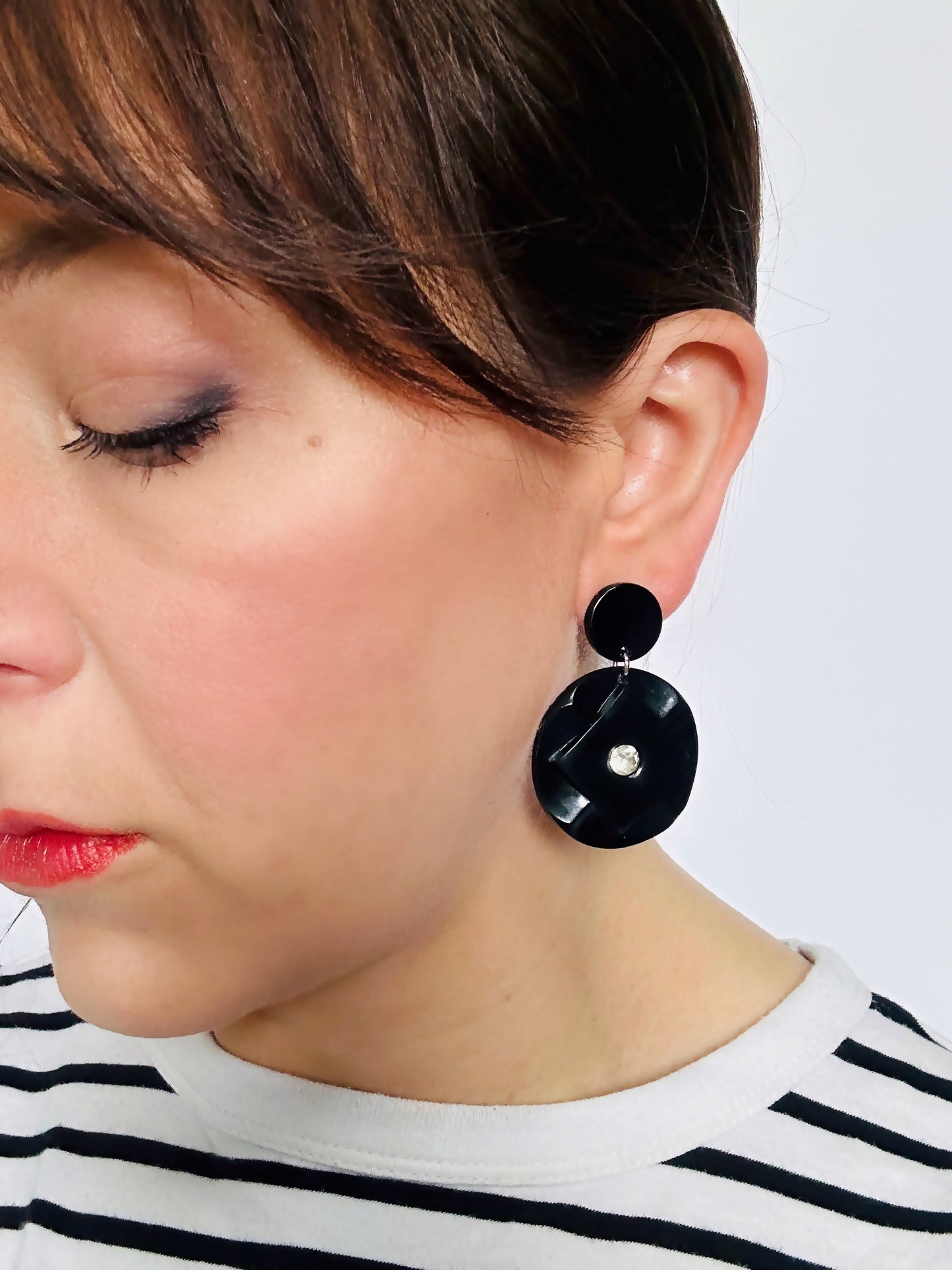 Large vintage black button earrings with rhinestone center