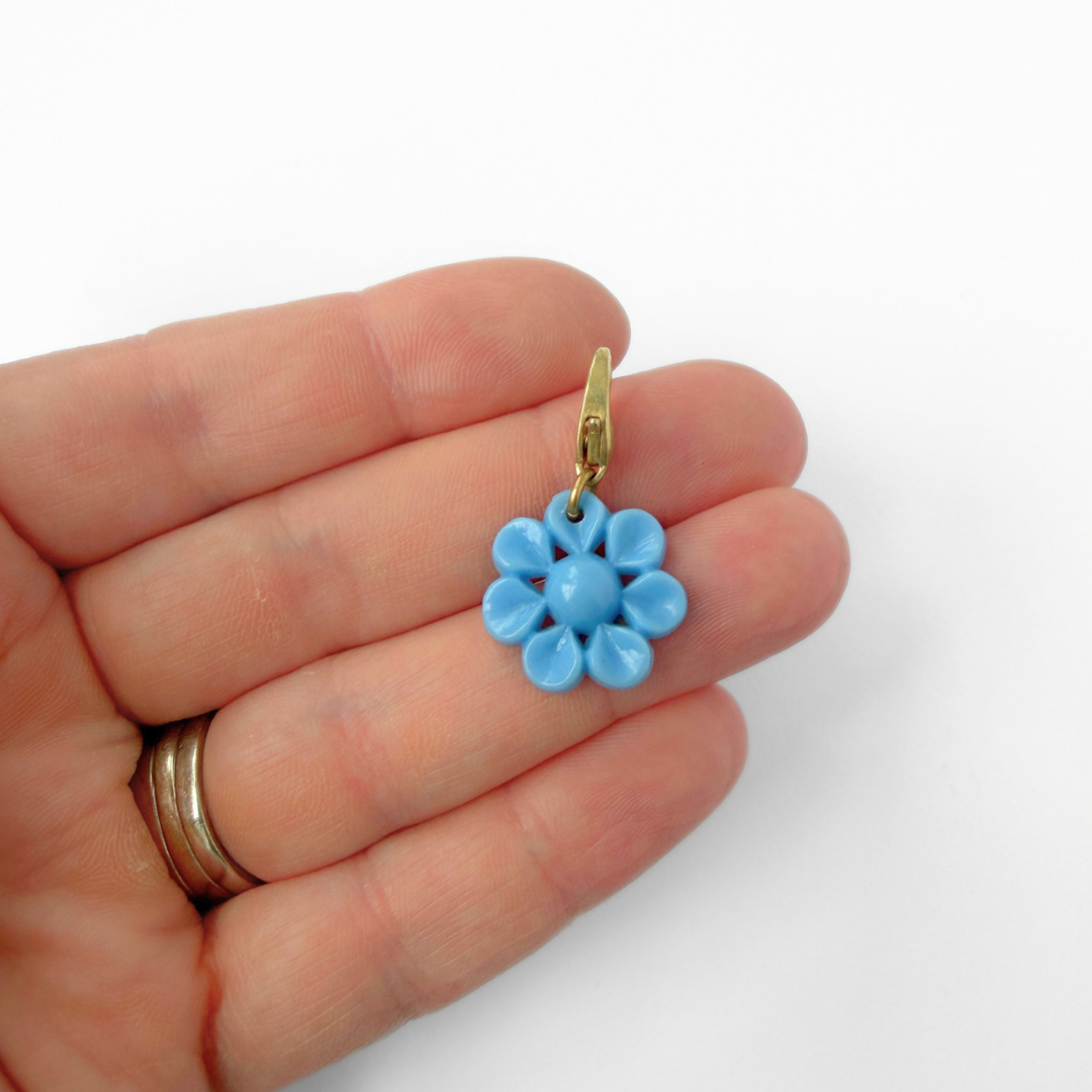 Small vintage powder blue plastic flower button charm