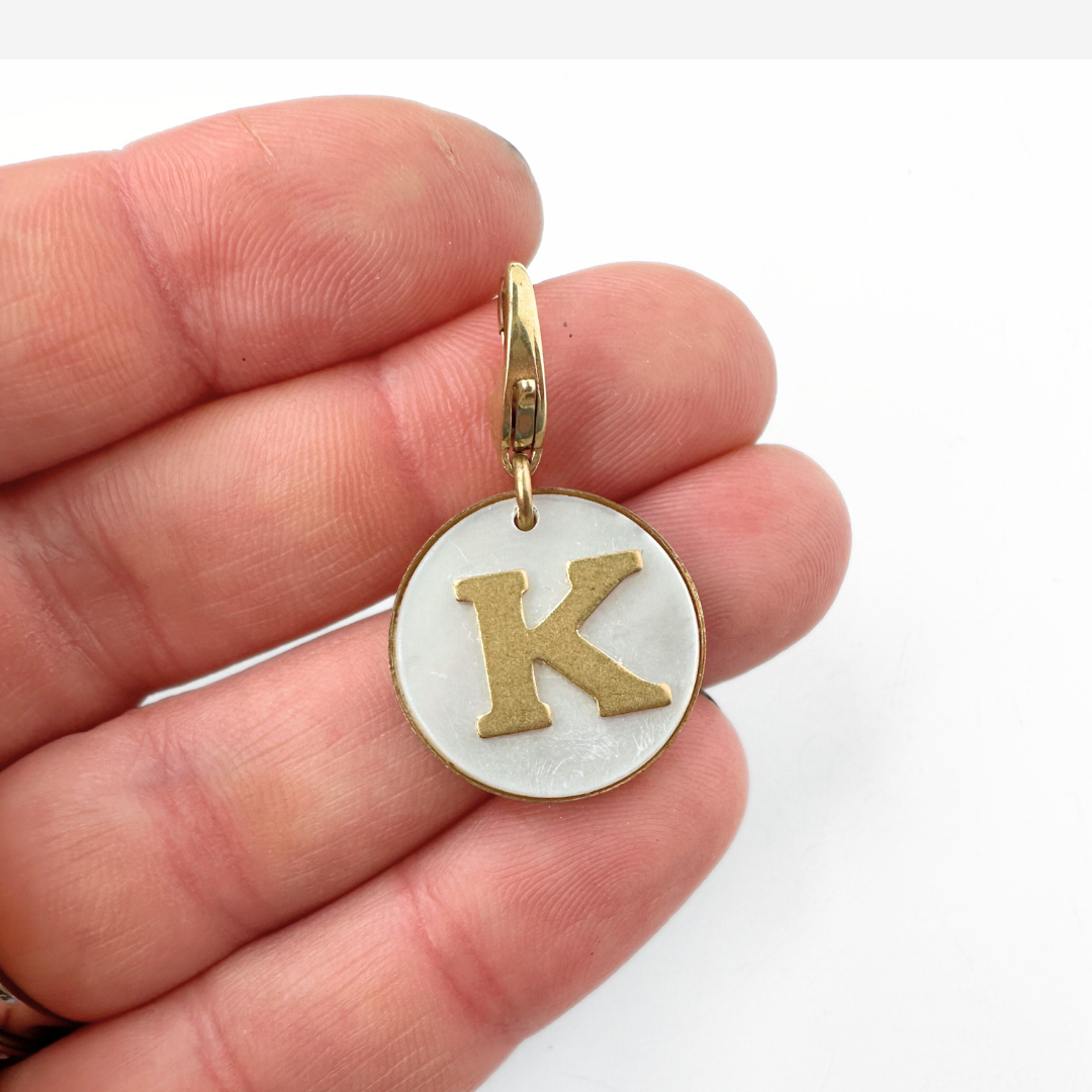 Vintage mother of pearl and brass "K" circle monogram charm