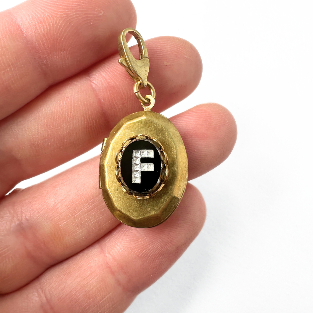 Vintage brass locket with black glass "F" monogram