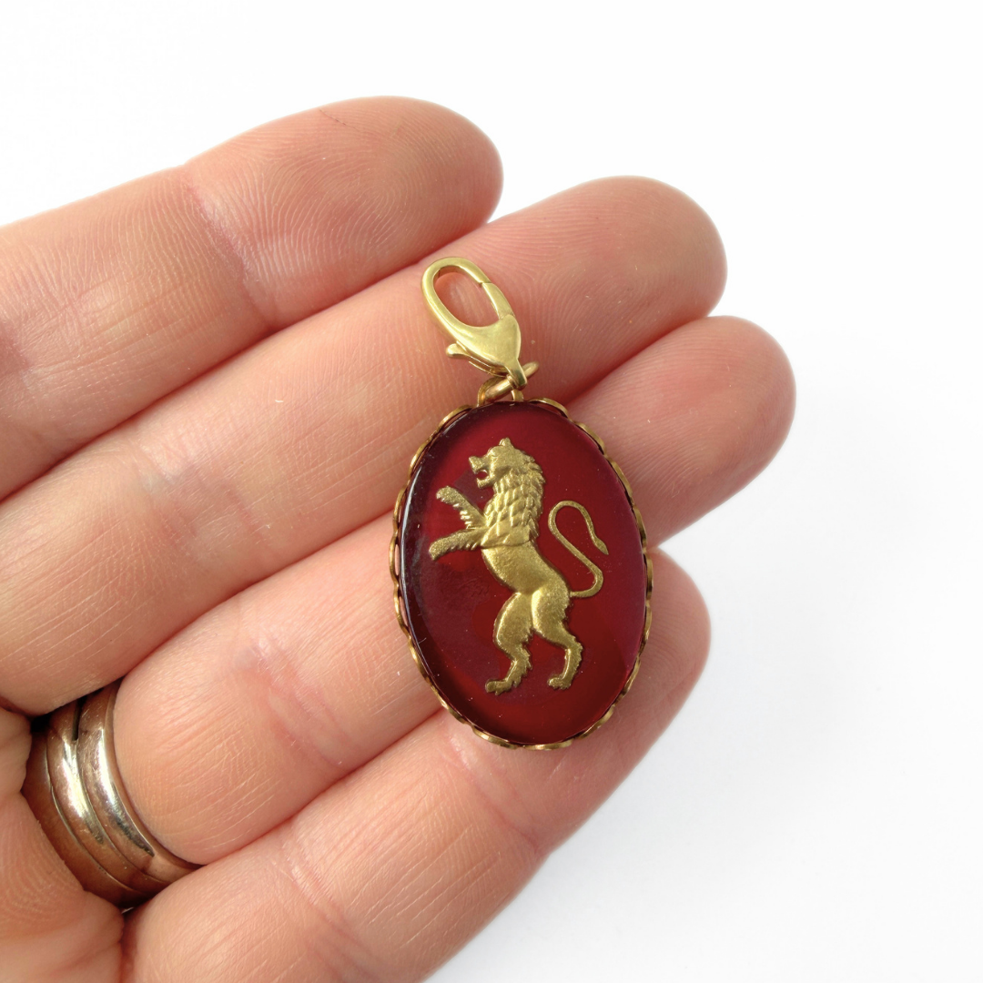 Vintage maroon and gold lion intaglio charm