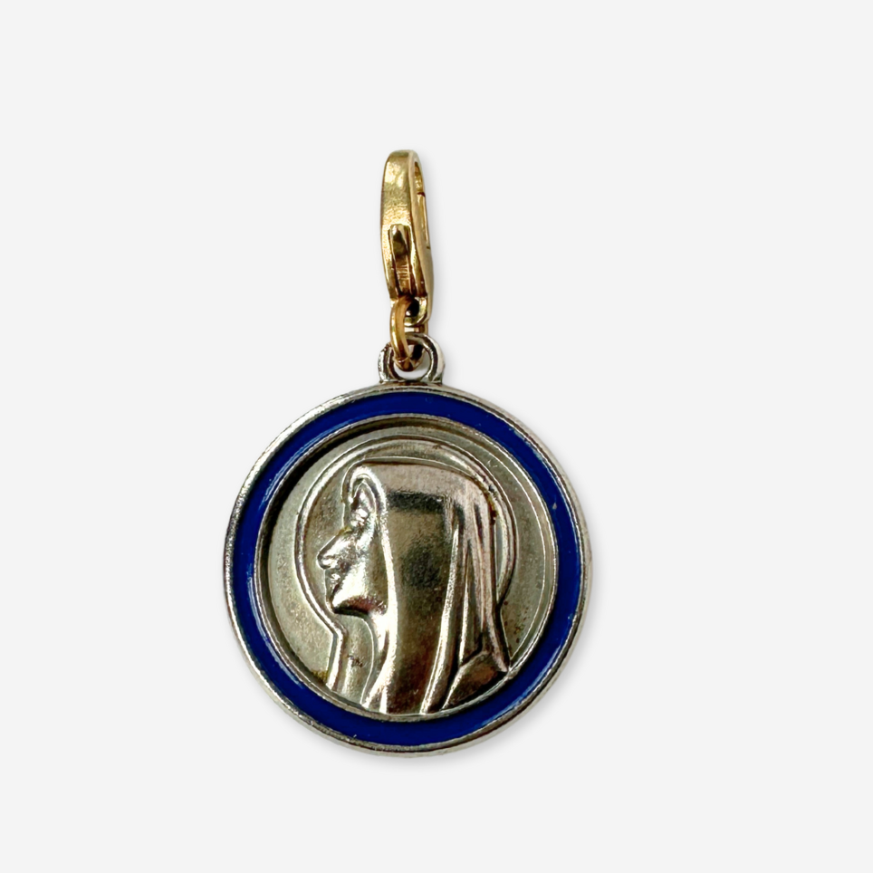 Vintage silver tone Our Lady of Lourdes circular charm with blue enamel