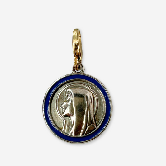 Vintage silver tone Our Lady of Lourdes circular charm with blue enamel