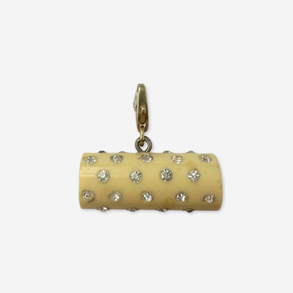 Vintage pale yellow rhinestone celluloid cylinder charm