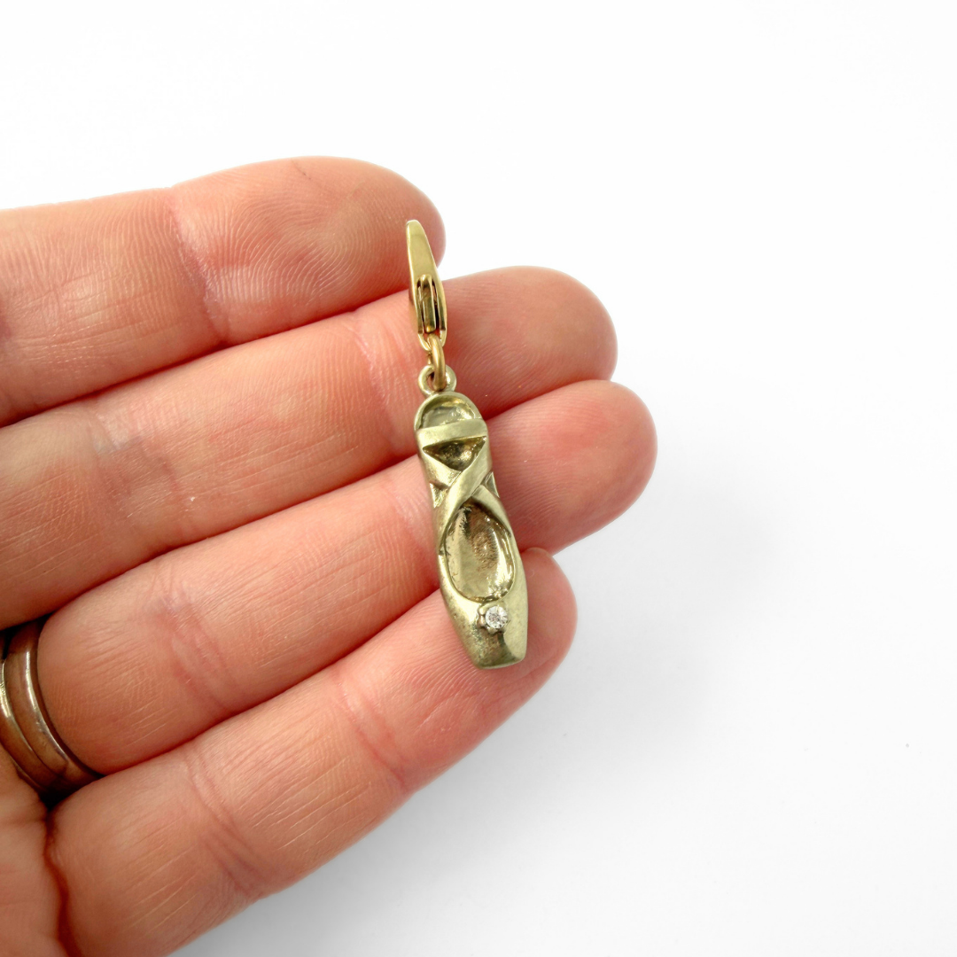 Vintage muted gold ballet slipper charm with clear rhinestone