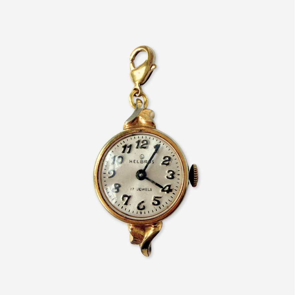 Vintage gold plated "Hilbros" circular watch face charm