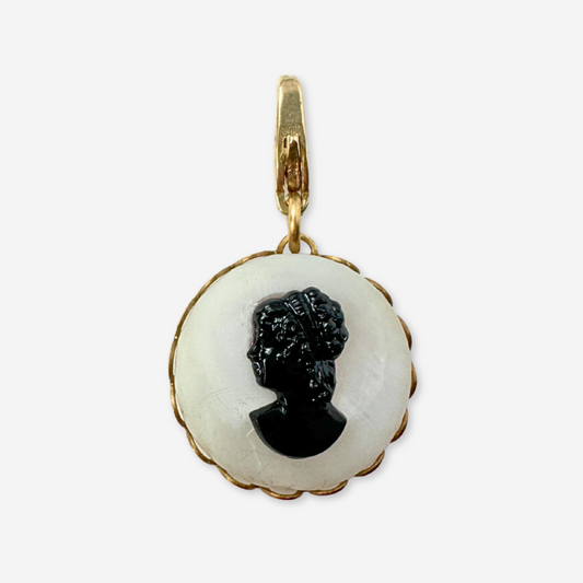 Circular black and white vintage cameo charm