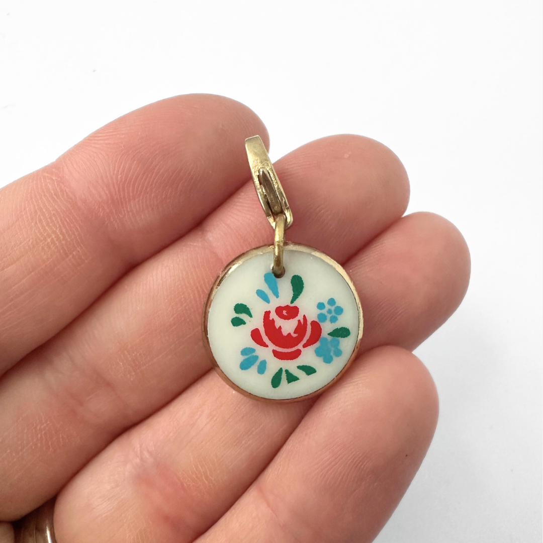 Vintage white glass and red floral circular charm