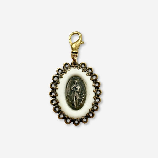 Vintage milk glass religious medallion charm with brass swivel clasp