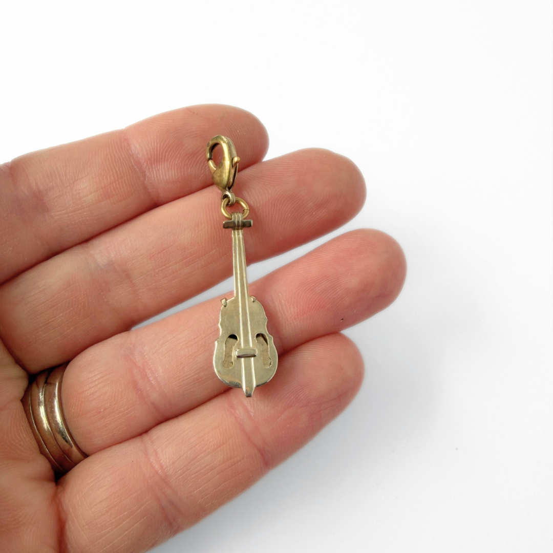 Vintage muted gold violin or cello charm