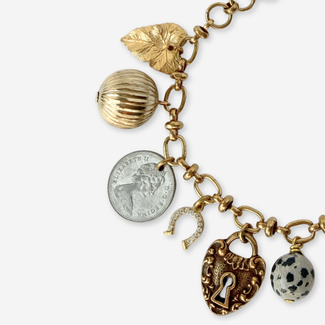 Repurposed vintage mixed neutral charm bracelet