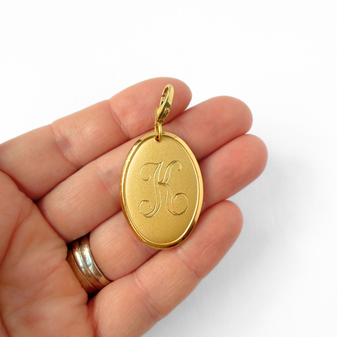 Vintage gold plated oval letter "K" monogram charm