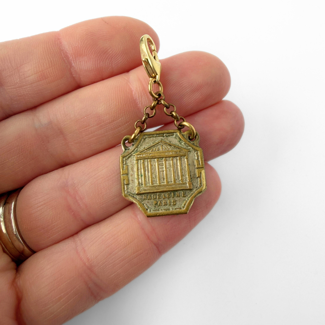 Vintage aged brass Parisian landmark medal charm: Madeleine Church