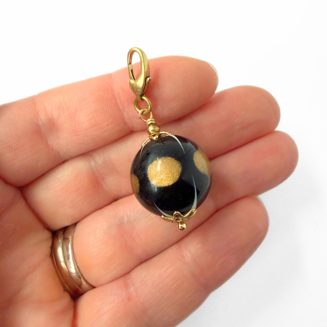 Vintage black, gold and white unique bead charm