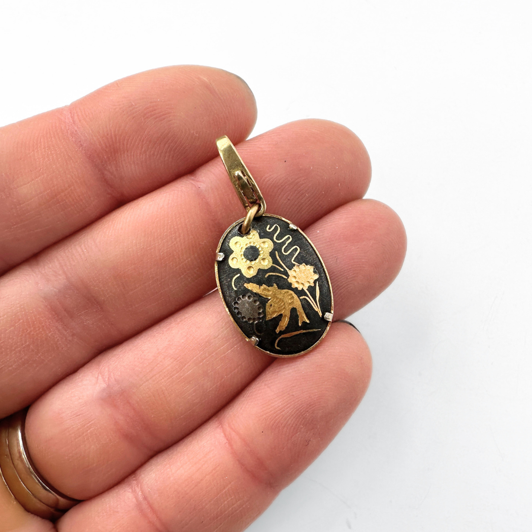 Vintage gold and black Damascene floral bird oval charm