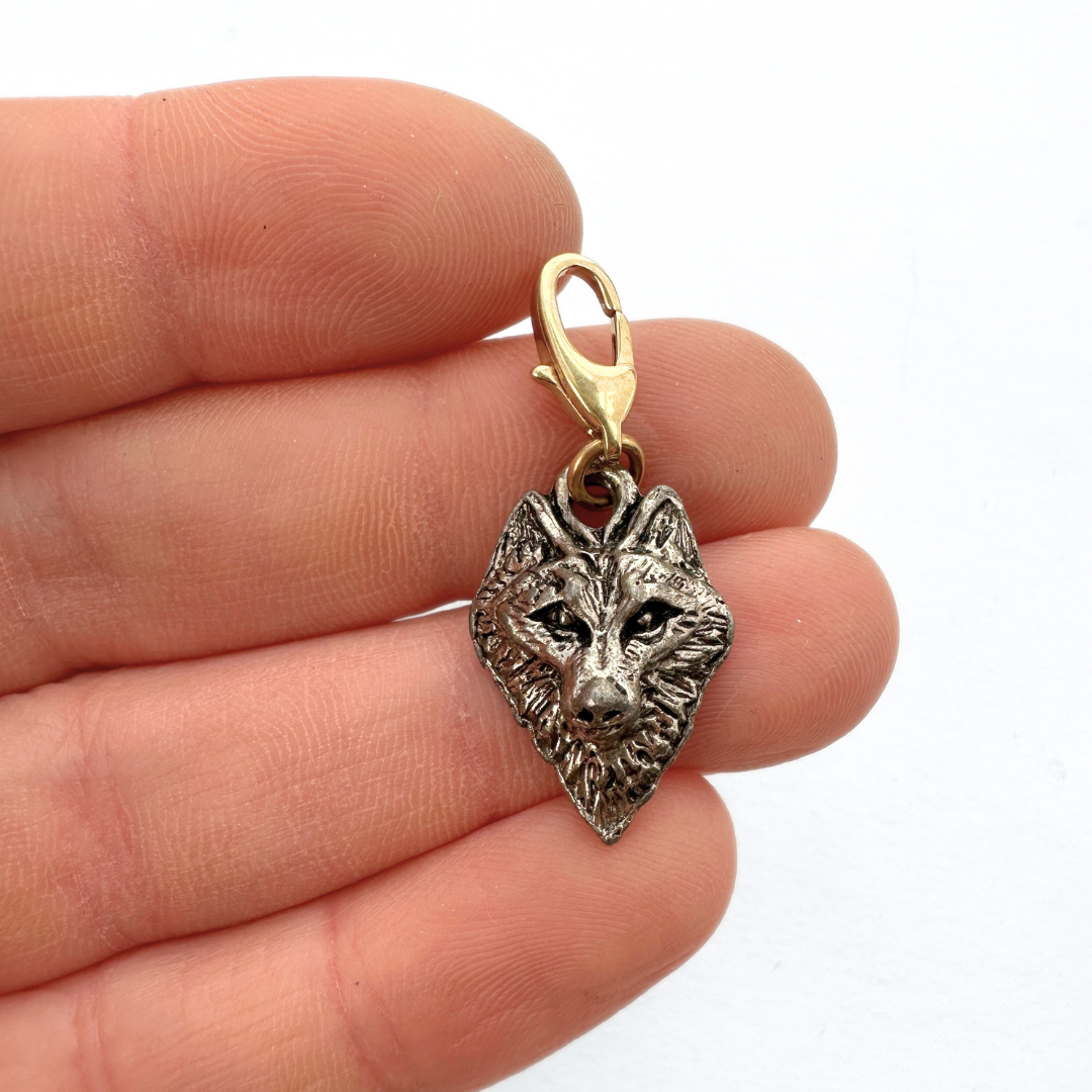 Small vintage silver wolf face charm
