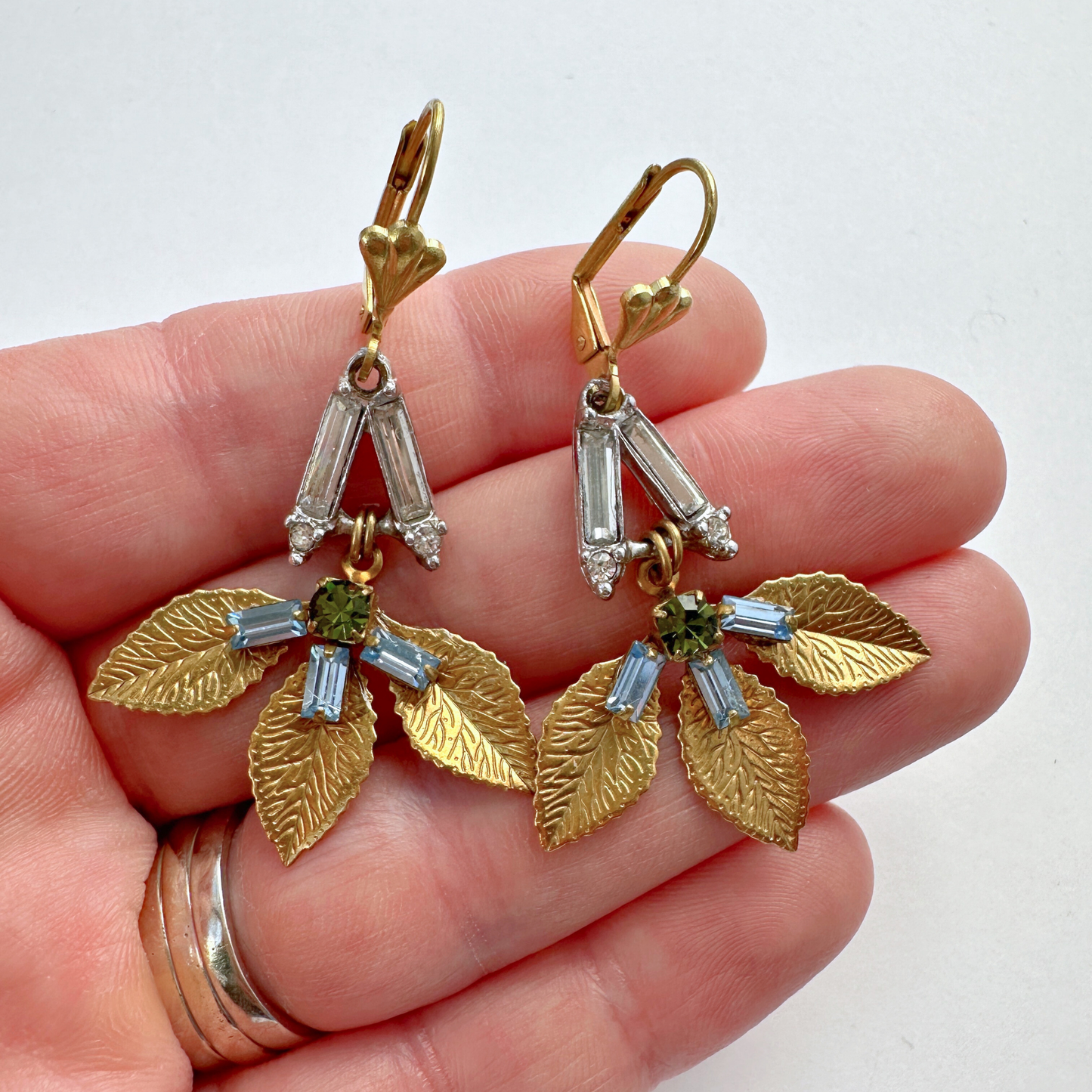 Refashioned vintage olive, ice blue, and clear rhinestone brass leaf earrings