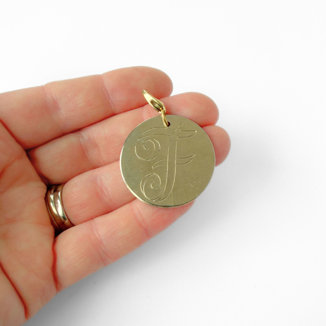 Large vintage gold plated circular "F" monogram charm