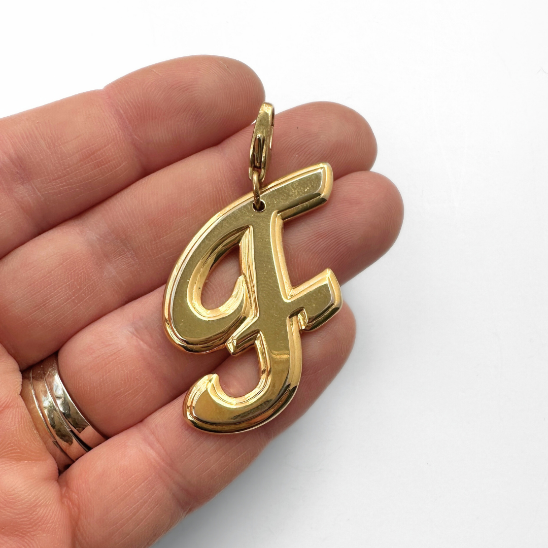 Large vintage shiny gold cursive "F" charm
