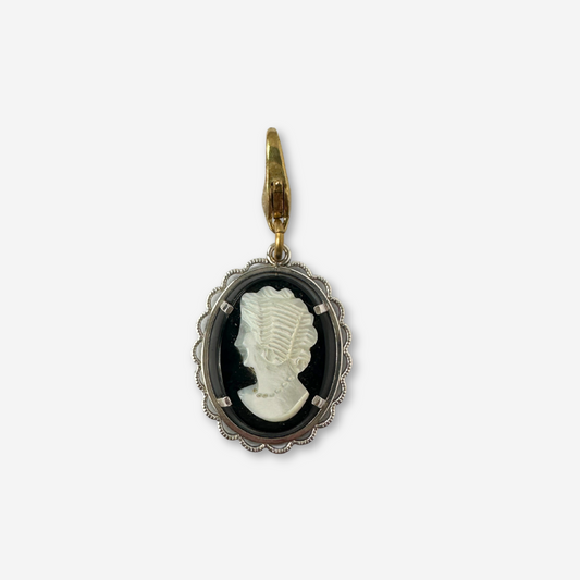 Vintage black and white cameo charm with silver setting and brass clasp