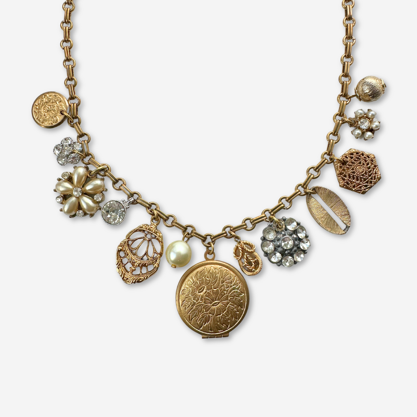 Repurposed brass, pearl and rhinestone vintage locket and charm necklace