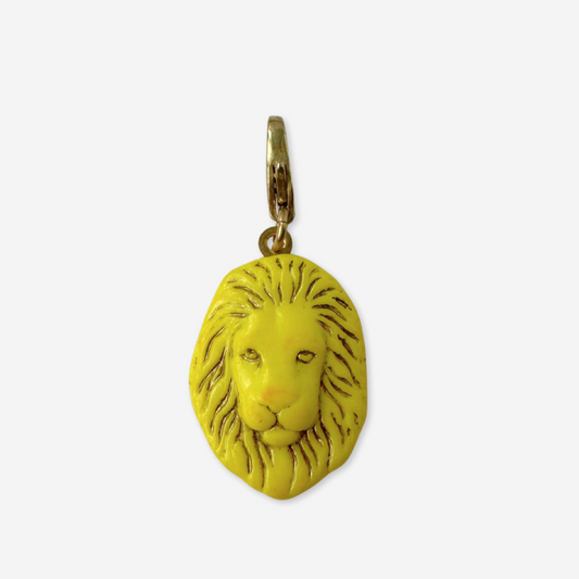 Yellow lion head pendant on a white background