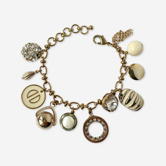 Repurposed vintage cream and gold mixed charm bracelet