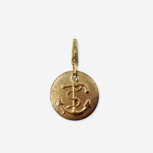 Gold pendant with anchor design on a white background