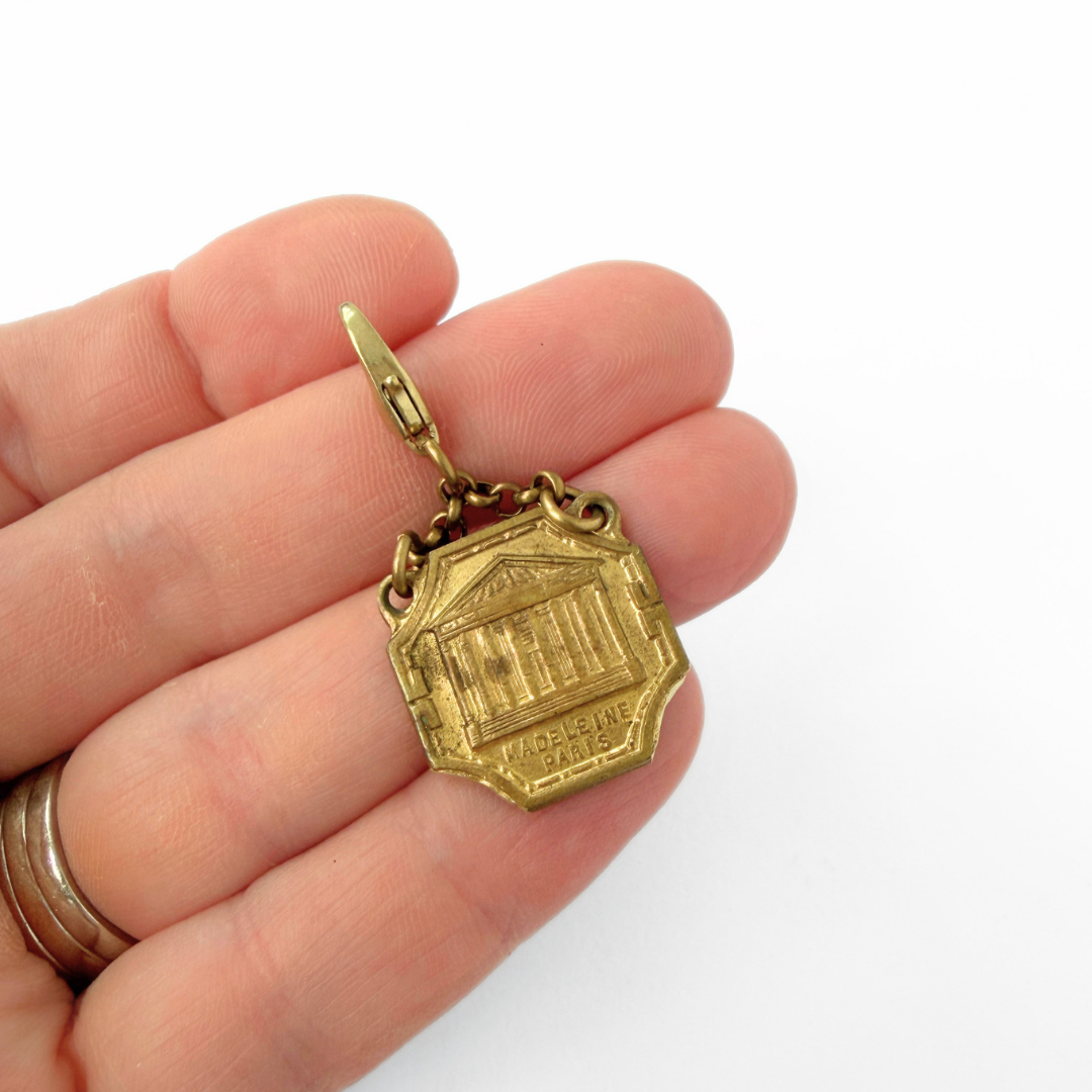 Vintage aged brass Parisian landmark medal charm: Madeleine Church