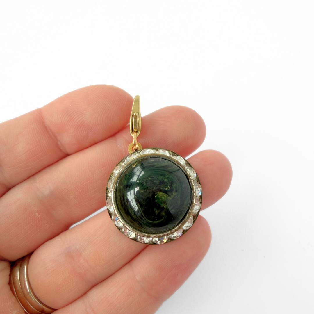 Vintage deep green bakelite and rhinestone circular charm