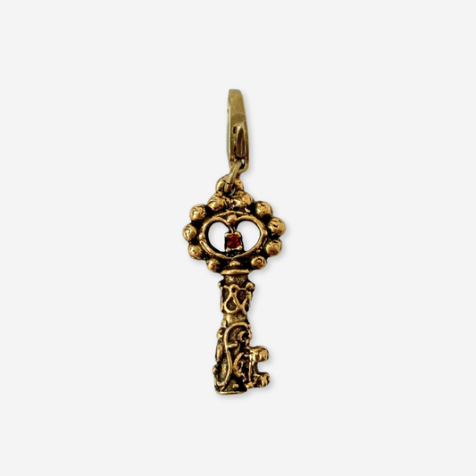 Vintage antique gold tone ornate key charm