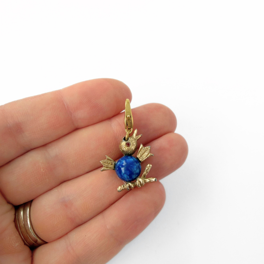 Vintage small gold tone bird charm with blue chest