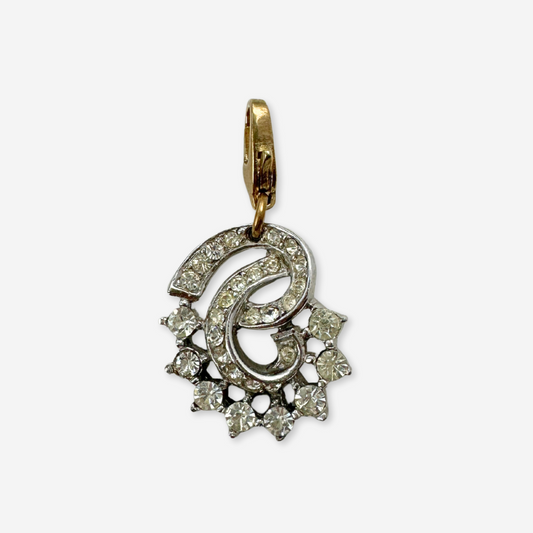 Vintage silver and clear rhinestone swirl charm