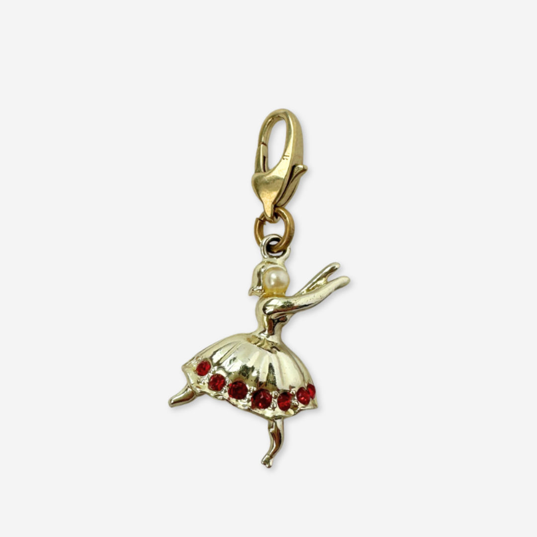 Vintage shiny gold dancer charm with red rhinestones