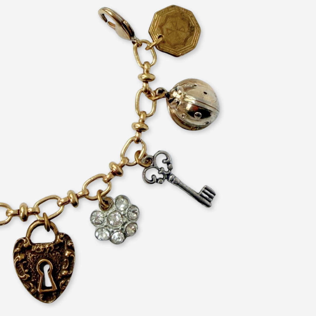 Repurposed vintage mixed neutral charm bracelet