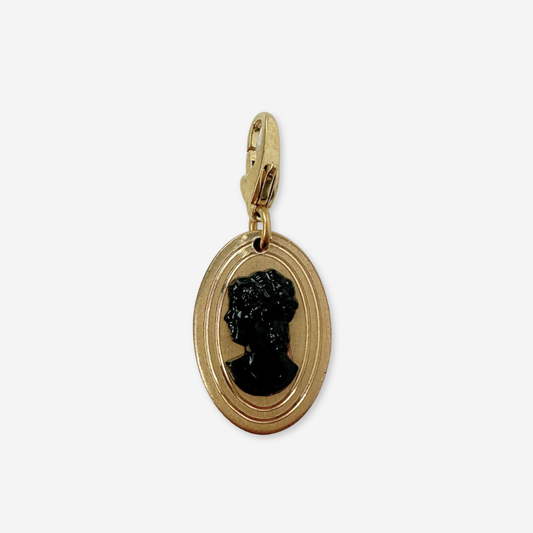 Vintage gold plated oval charm with black cameo silhouette