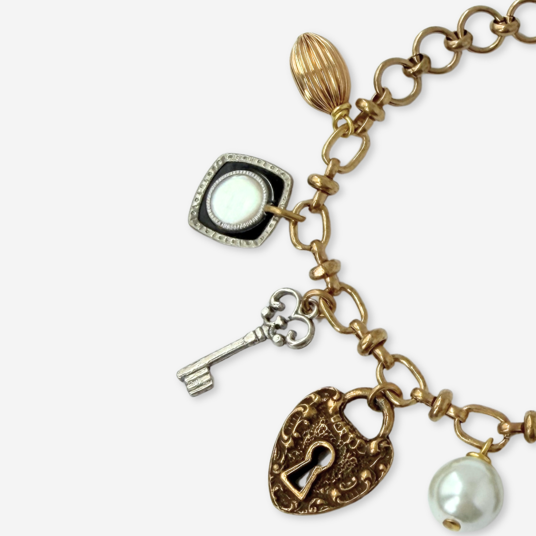 Repurposed vintage mixed neutral charm bracelet