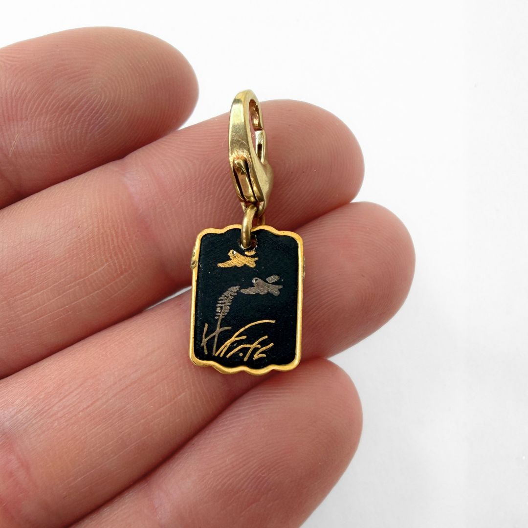 Vintage gold and black small Japanese Damascene bird charm