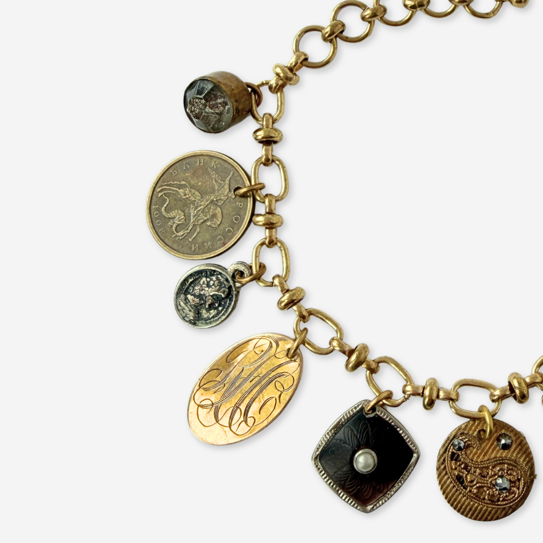 Repurposed vintage mixed neutral charm bracelet